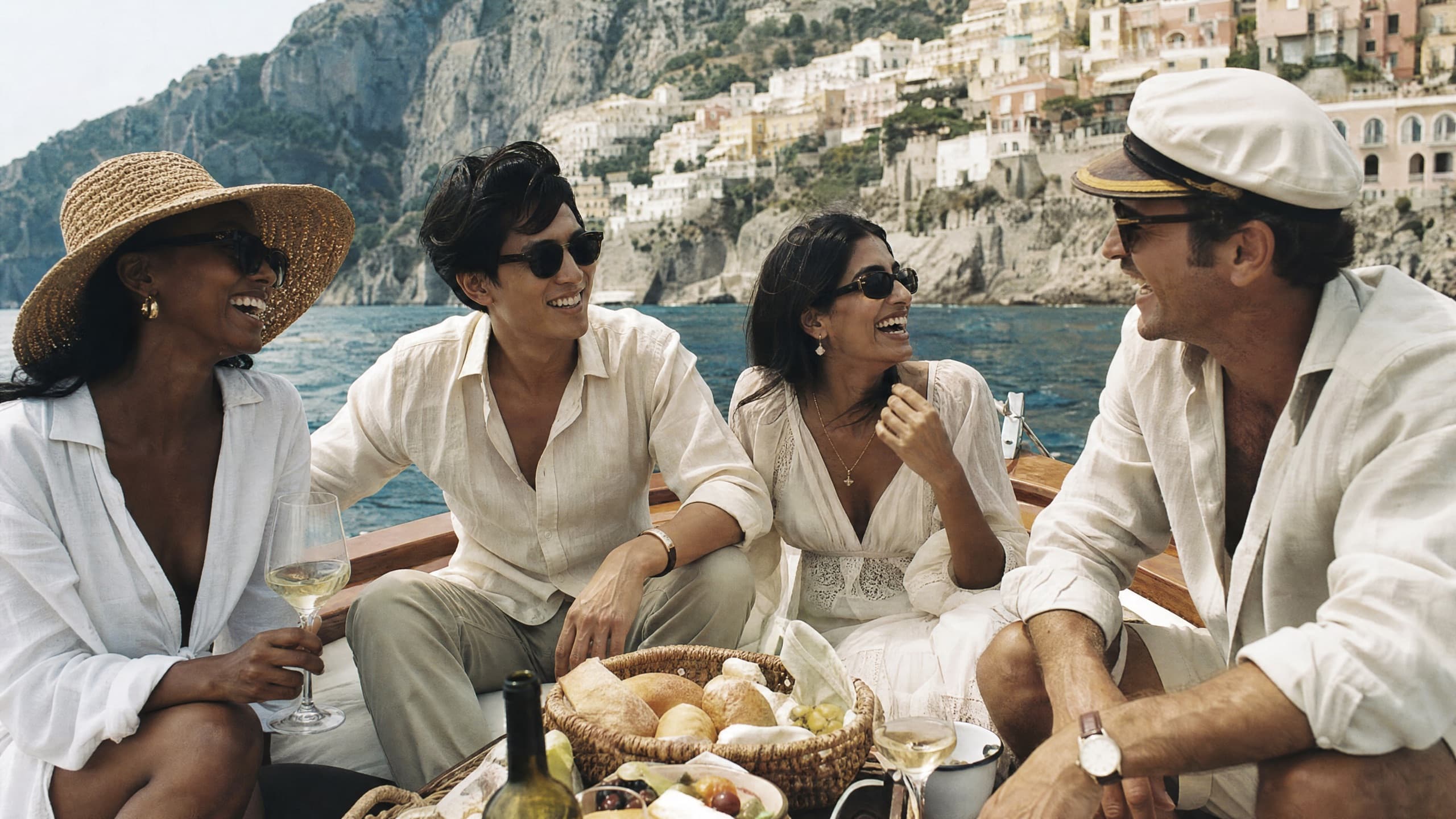 Friends at a seaside table on the Amalfi coast
